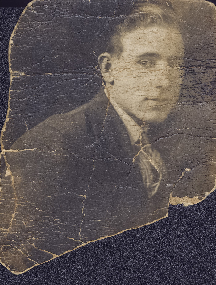 100-year old badly creased and torn photo before restoration