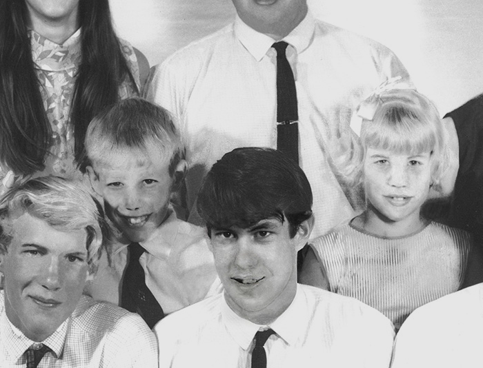 faces rebuilt to remove sub damage in this photo restoration