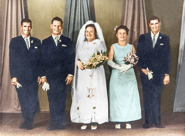 bridal group pops out of faded photo in this photo restoration
