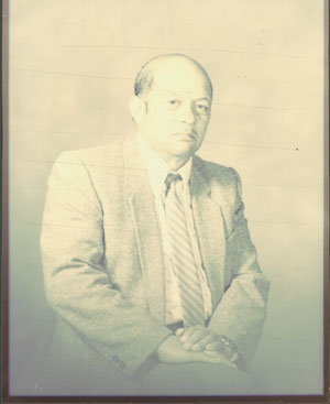 faded image of deceased Dad needed a lot of freshening and recolouring in this restoration