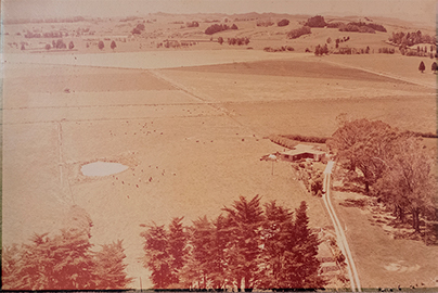 large faded-brown farm photo turns up for restoration