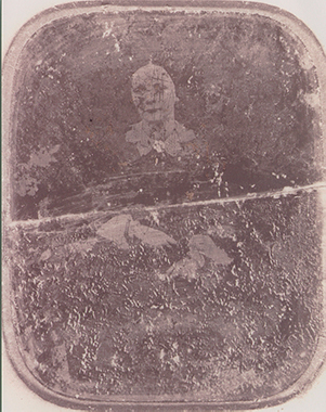badly faded and damaged photo of ancestor submitted for restoration