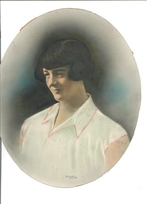 defaced hand-painted photo of mother as young woman waits for restoration