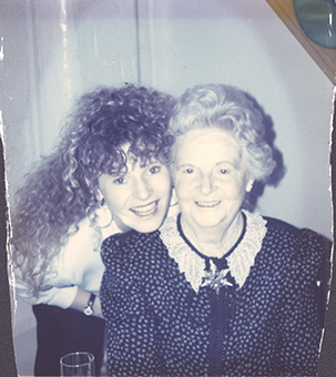 tattered photo of beloved aunt witrh client waits for restoration