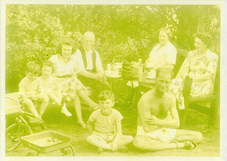 old very yellowed image of the family brought in for restoration.