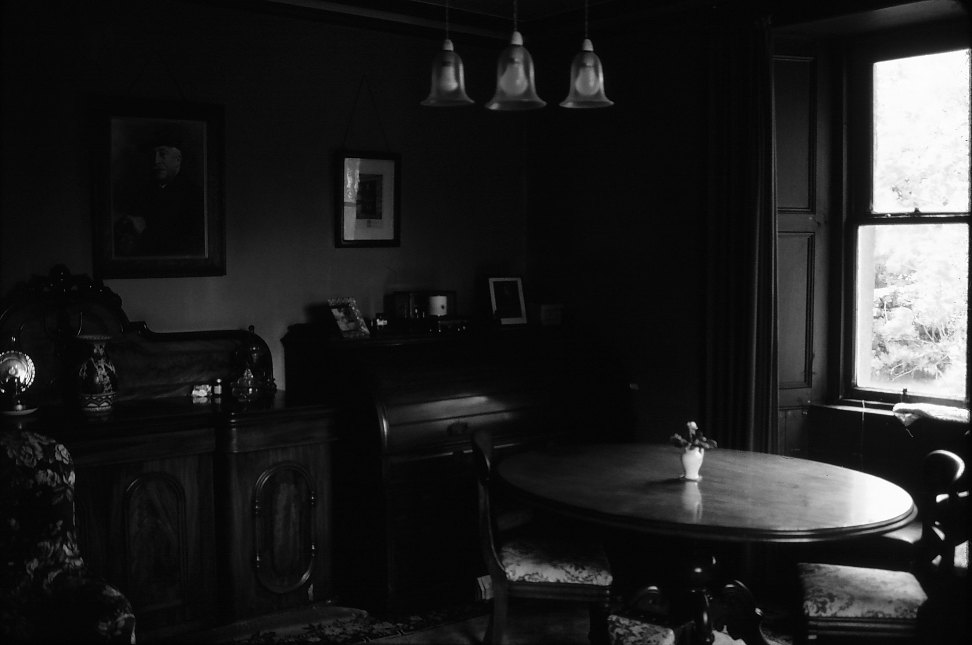 badly under-exposed photo arrives for editing for  genealogy book