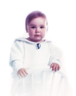 restored photo of yellow child now has natural flesh tones
