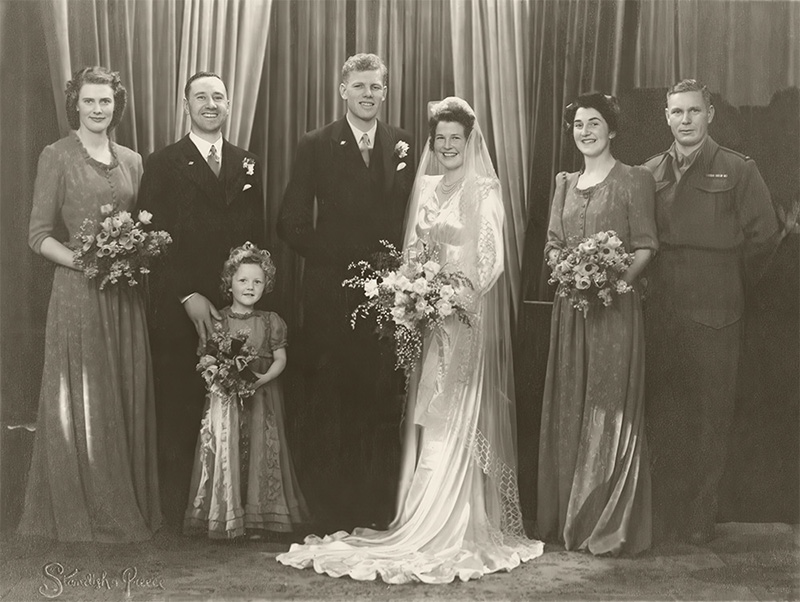 Faded and silver coated image of bridal grouprestored to new