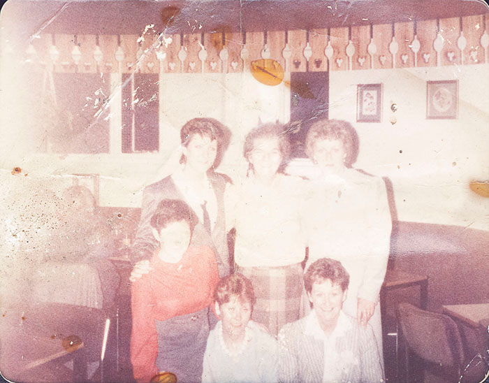 badly damaged, faded, grubby small photo submitted for redcolouring and restorationto
