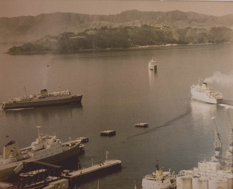 large discoloured and faded photo of ferries needing restoration