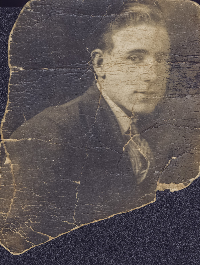 badly torn, creased marked photo of grandfather as a young man to be restored