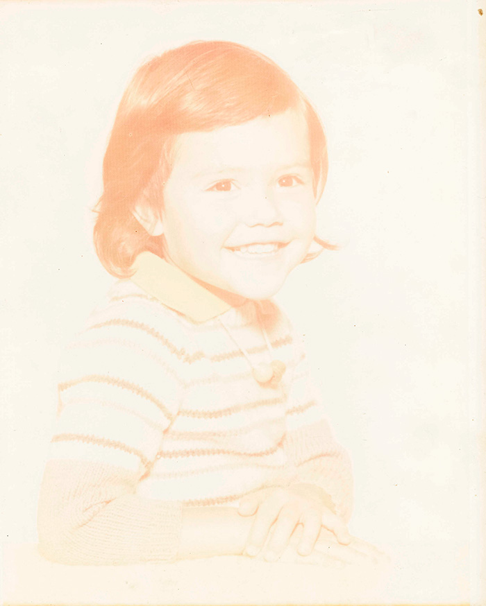 very faded coloured photo of small girl brought in for total refresh