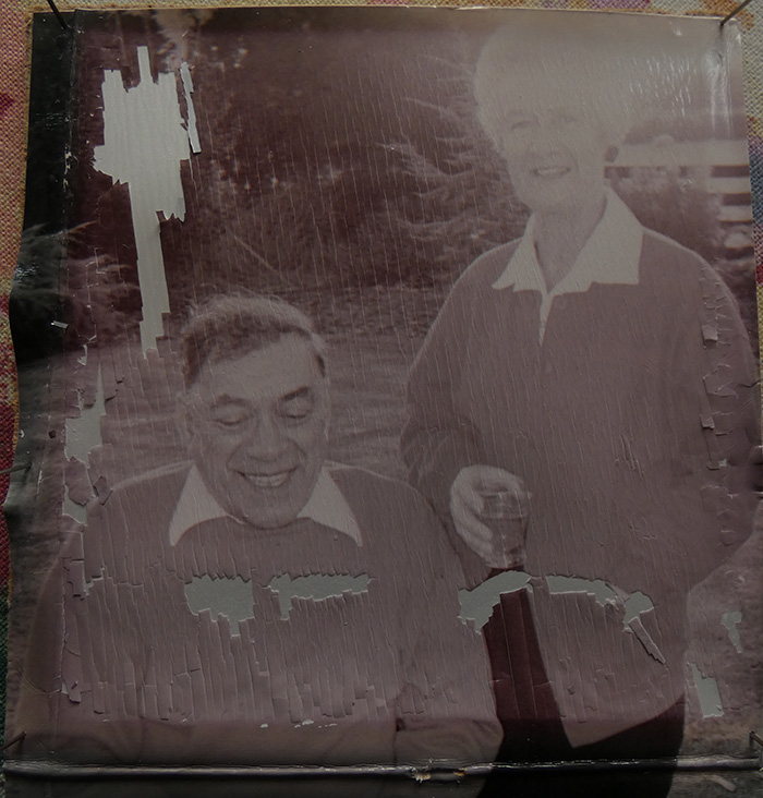 old, faded, discoloured, backlit, disintegrating photo needs restoration
