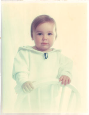 faded and yellowed child photo comes for restoration